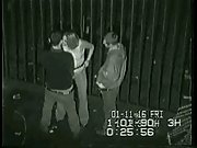 A threesome outside having public sex at the back of a club